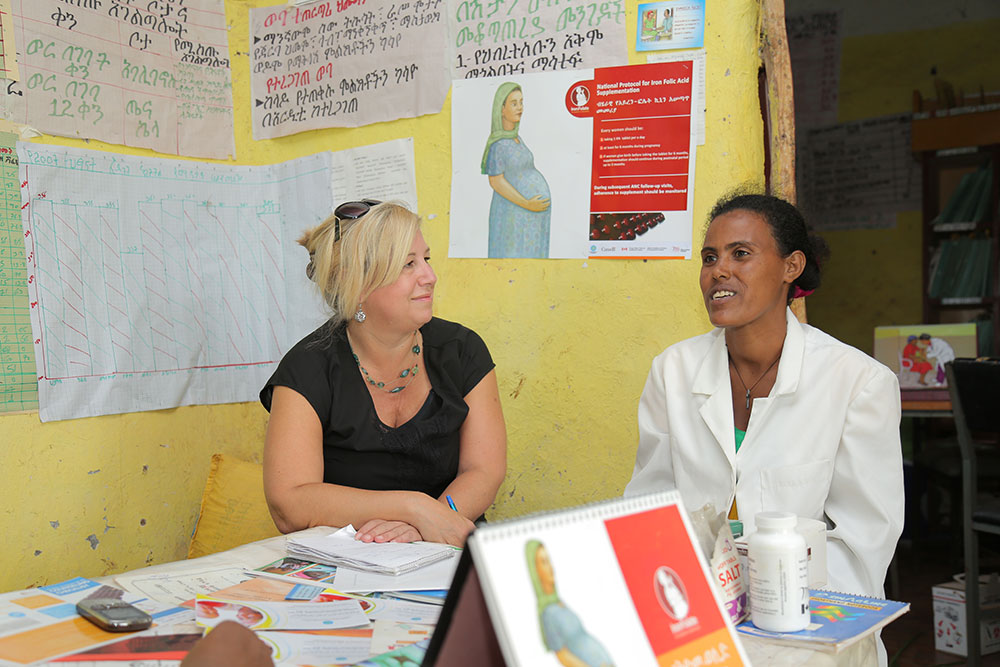 Chris Dendys, MI’s Director, External Relations, with Tibeltalech Kifle, a Health Extension Worker, during a field visit to the Yewonchit health post in South Gondar, Ethiopia, in July 2015