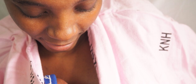 A mother practicing kangaroo mother care with her baby.