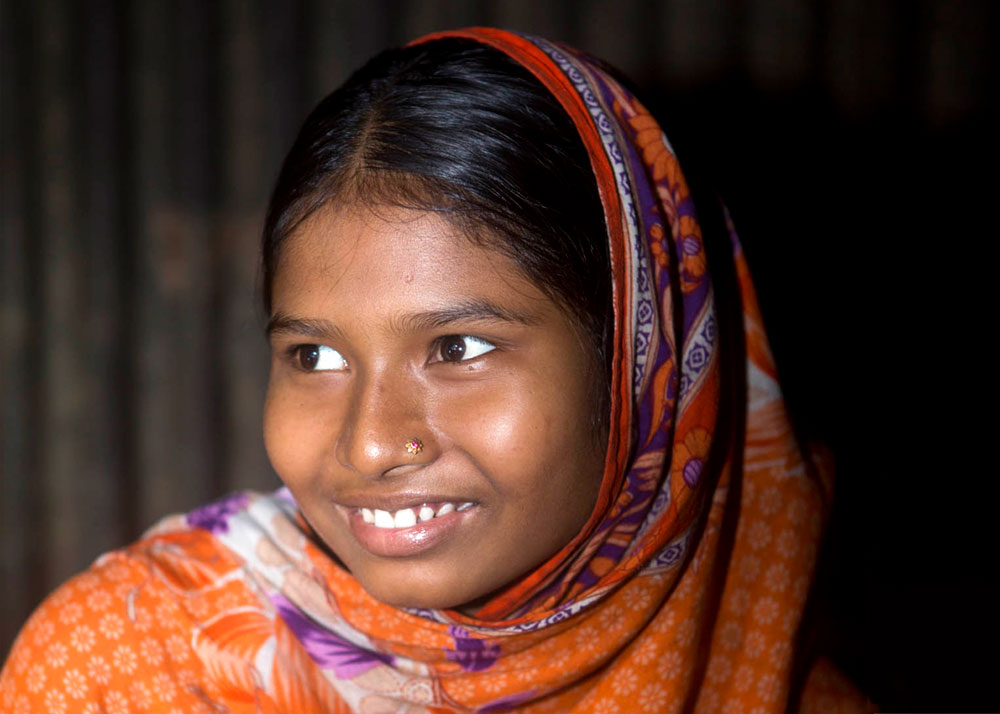 Happy, 15, is pregnant and lives in a slum of Dhaka, Bangladesh.