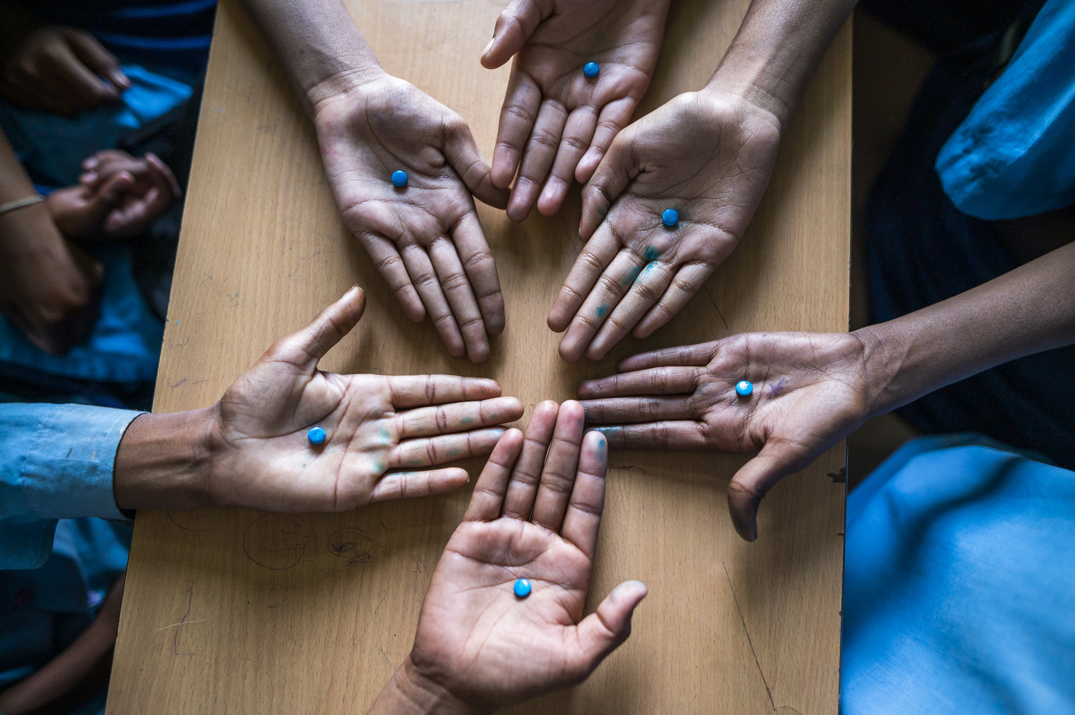 Hands show off the WIFAS supplements