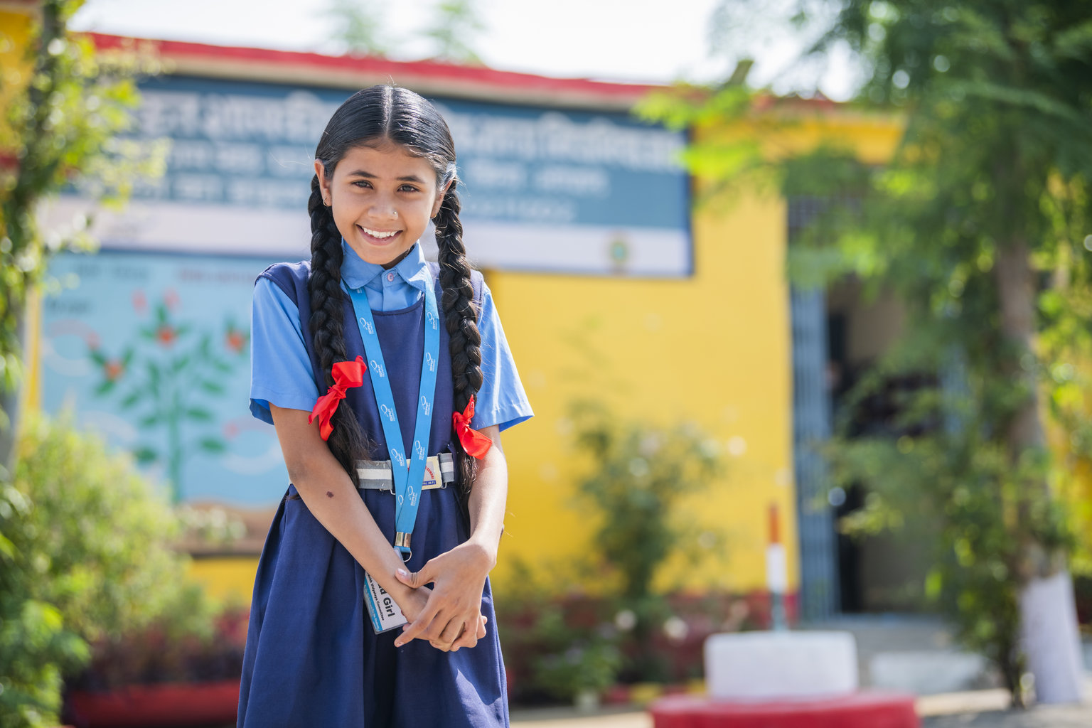 Adolescent girl standing facing the camera