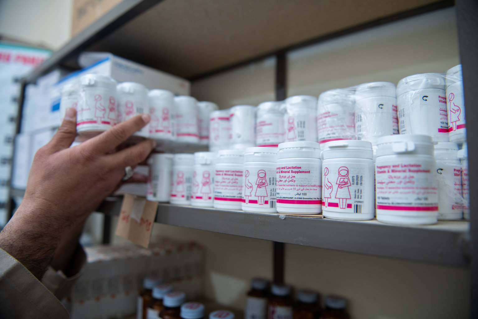 A series of stacked pill bottles