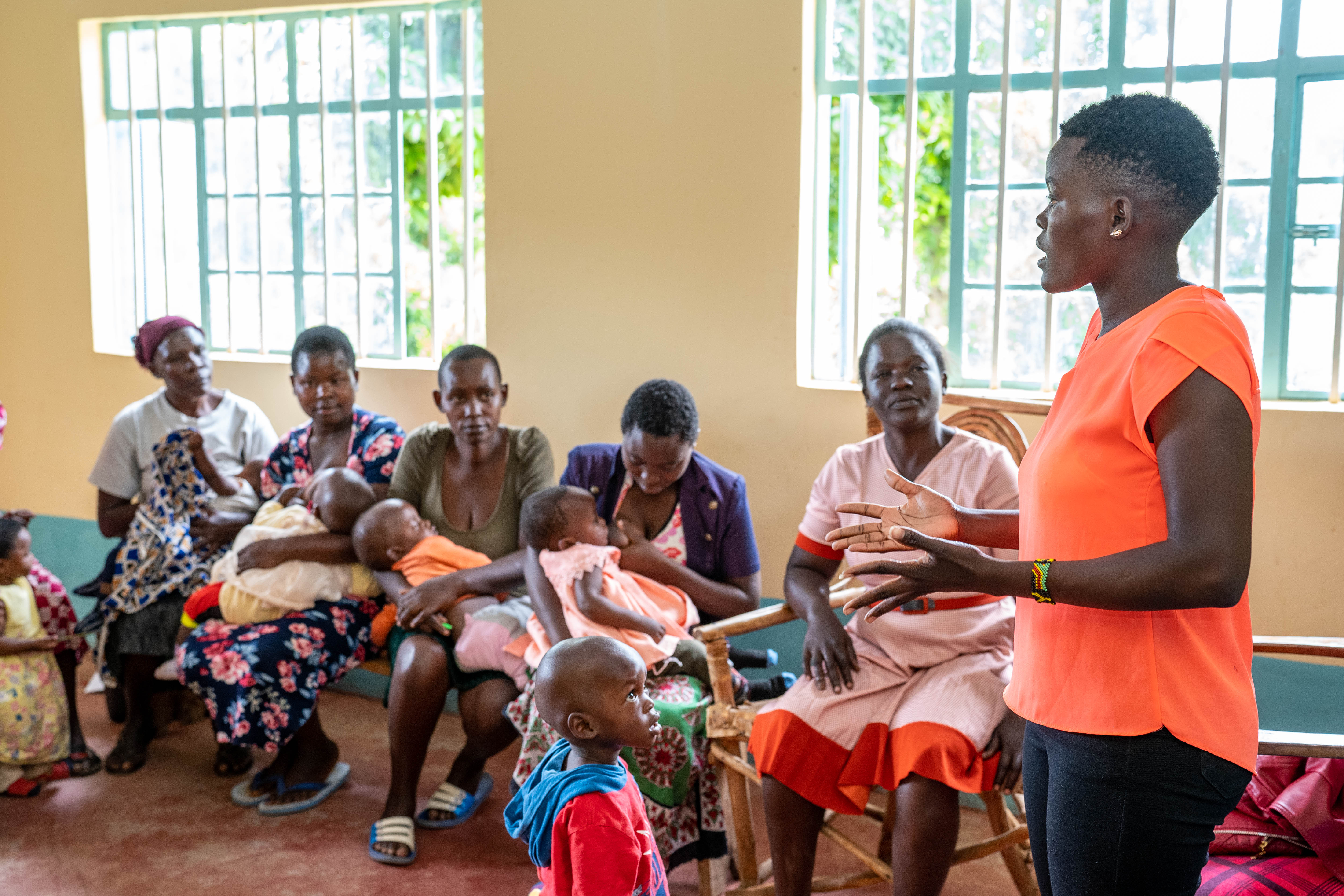 A group of women listen to a presentation.